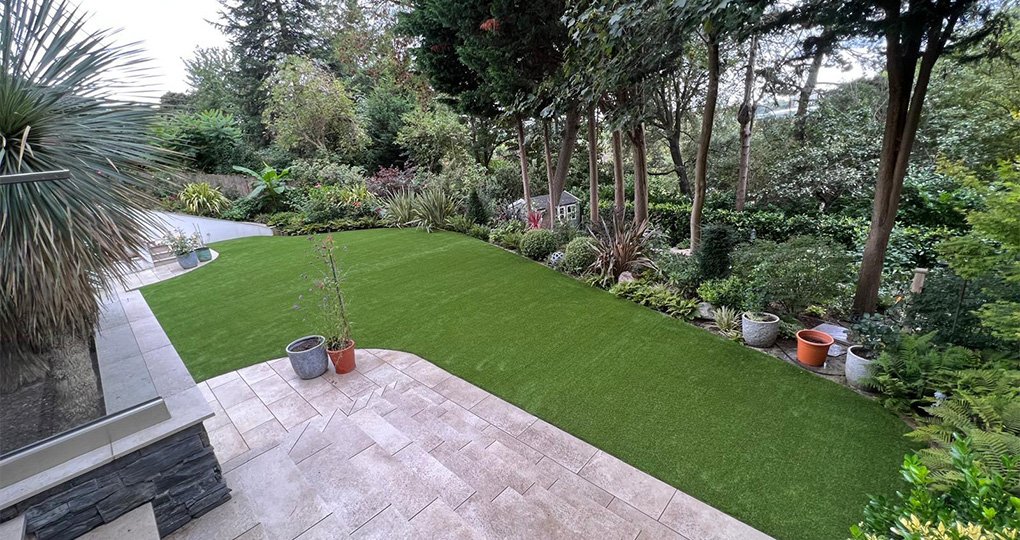 Family enjoying the new artificial lawn